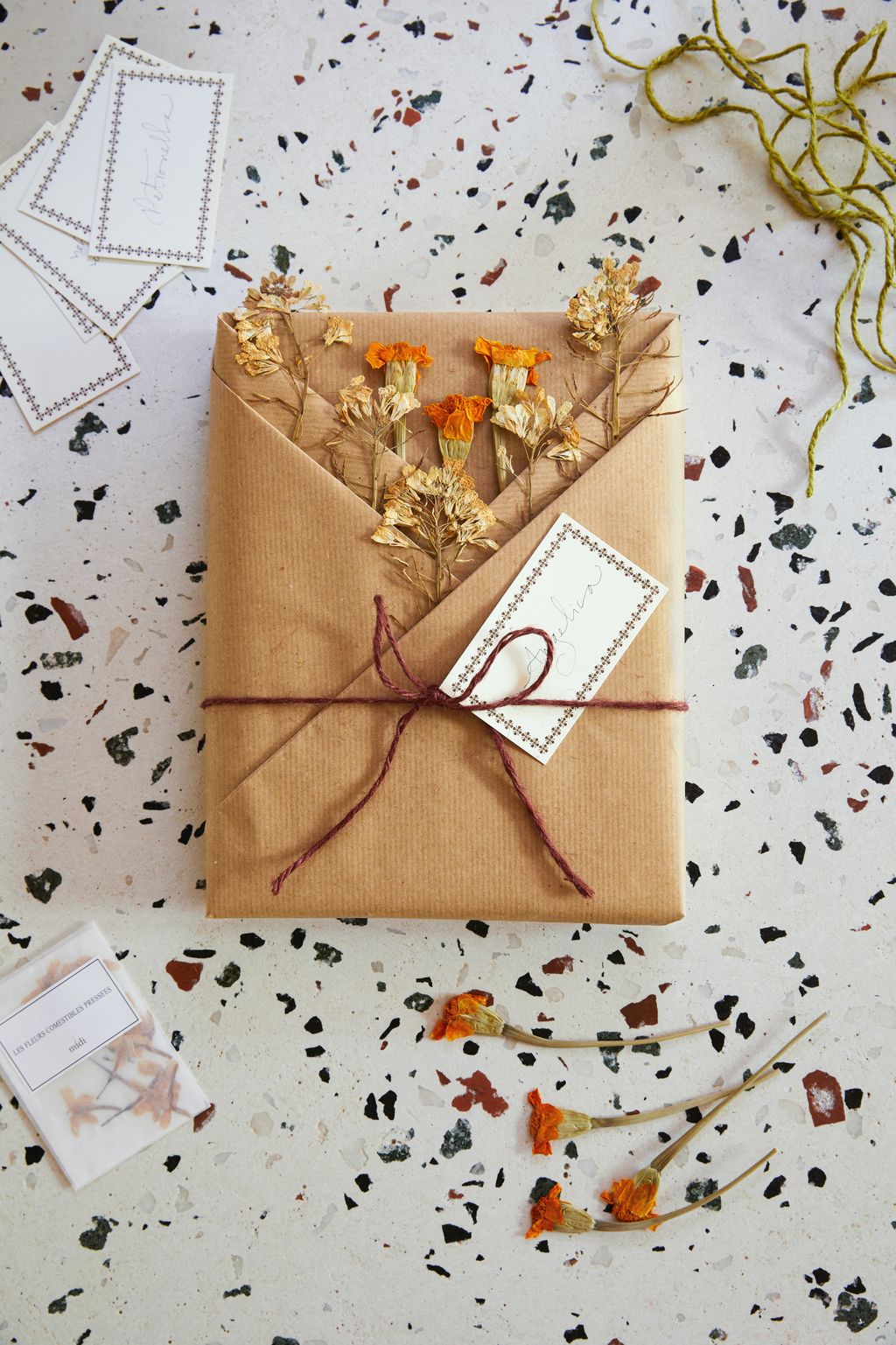 Use wrapping paper to create a layer of pockets into which you can tuck dried flowers or a gift card  this is ideal for...