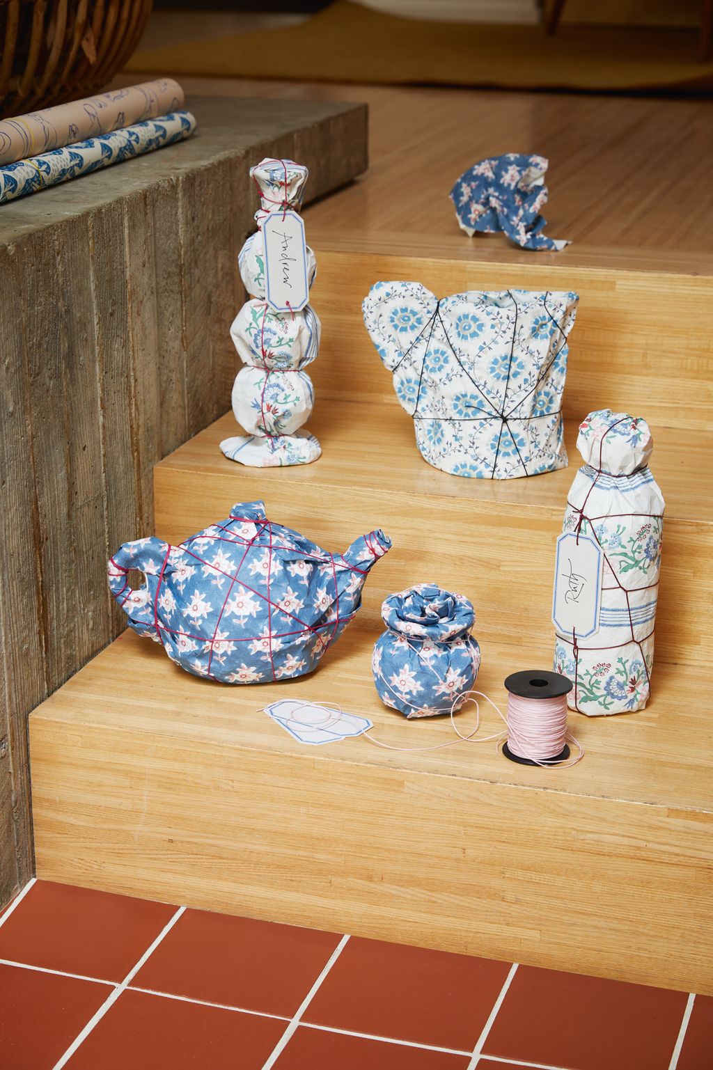 You can use up leftover rolls of wallpaper or wallpaper sample sheets as a strong and beautifully decorative alternative...