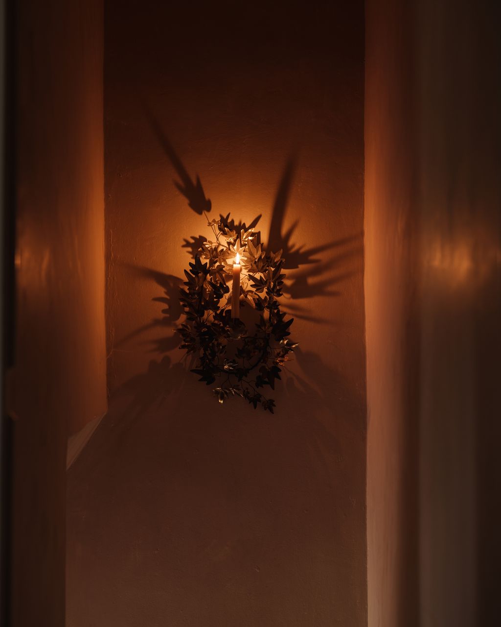 Image may contain Chandelier Lamp and Candle