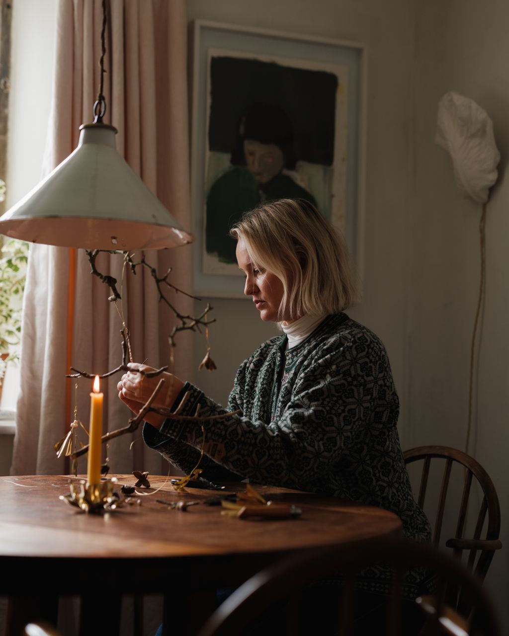 Image may contain Adult Person Lamp People Dining Table Furniture Table Face Head and Candle