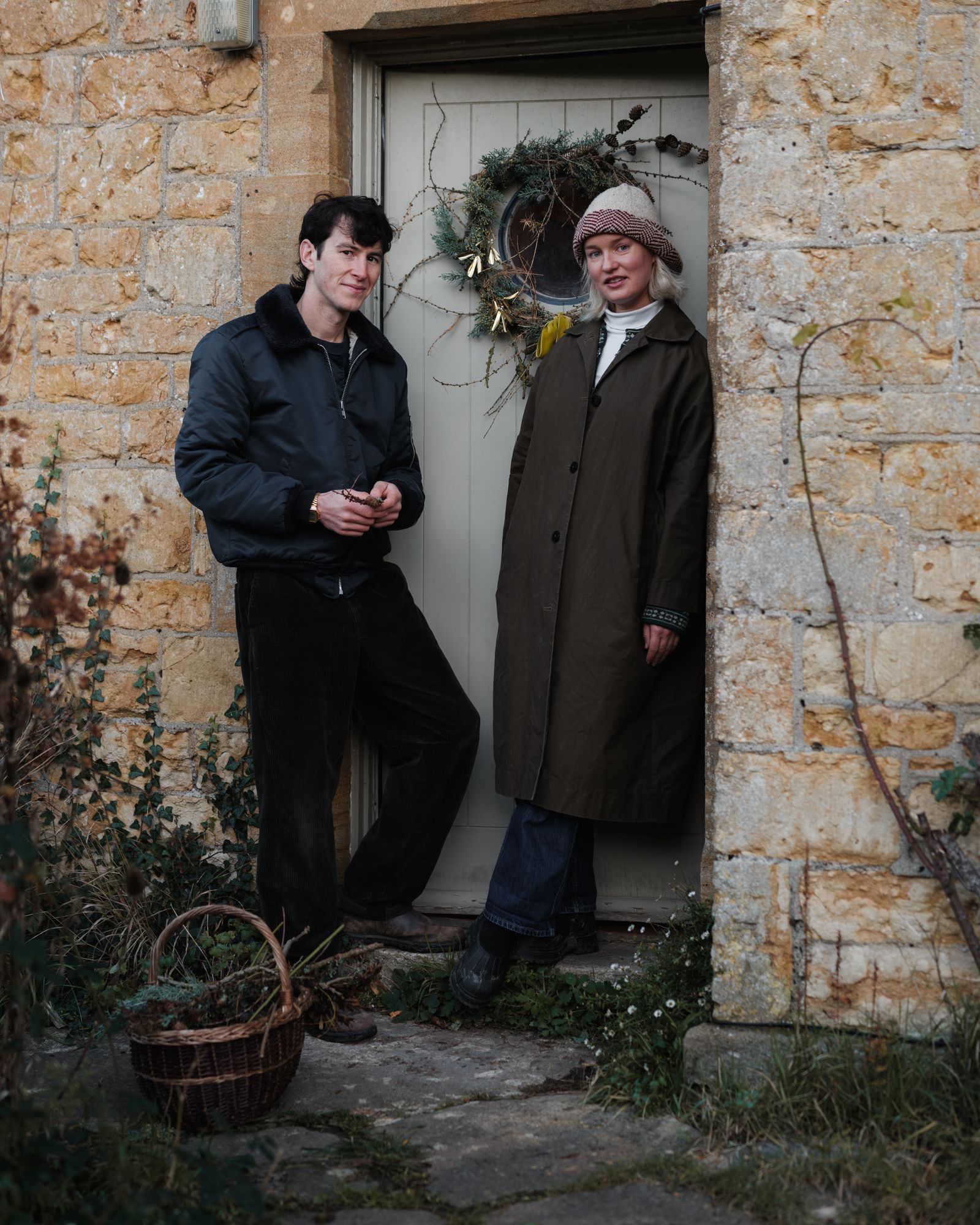 Image may contain Clothing Coat Jacket Plant Potted Plant Pants Blazer Face Head Person Photography and Portrait