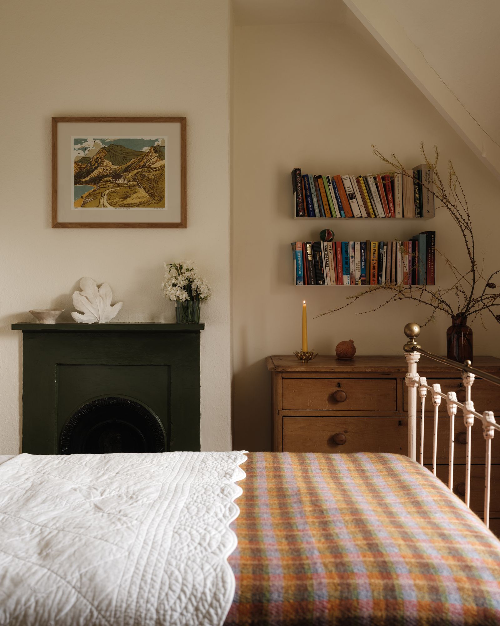 Image may contain Furniture Home Decor Indoors Interior Design Art Painting Candle Bed Cushion Rug and Bedroom