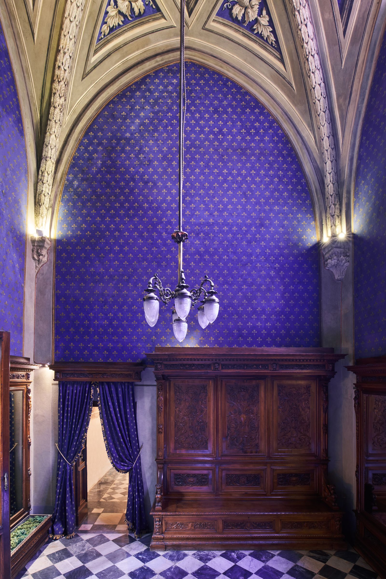 Image may contain Chandelier Lamp Architecture Building Indoors Interior Design and Arch